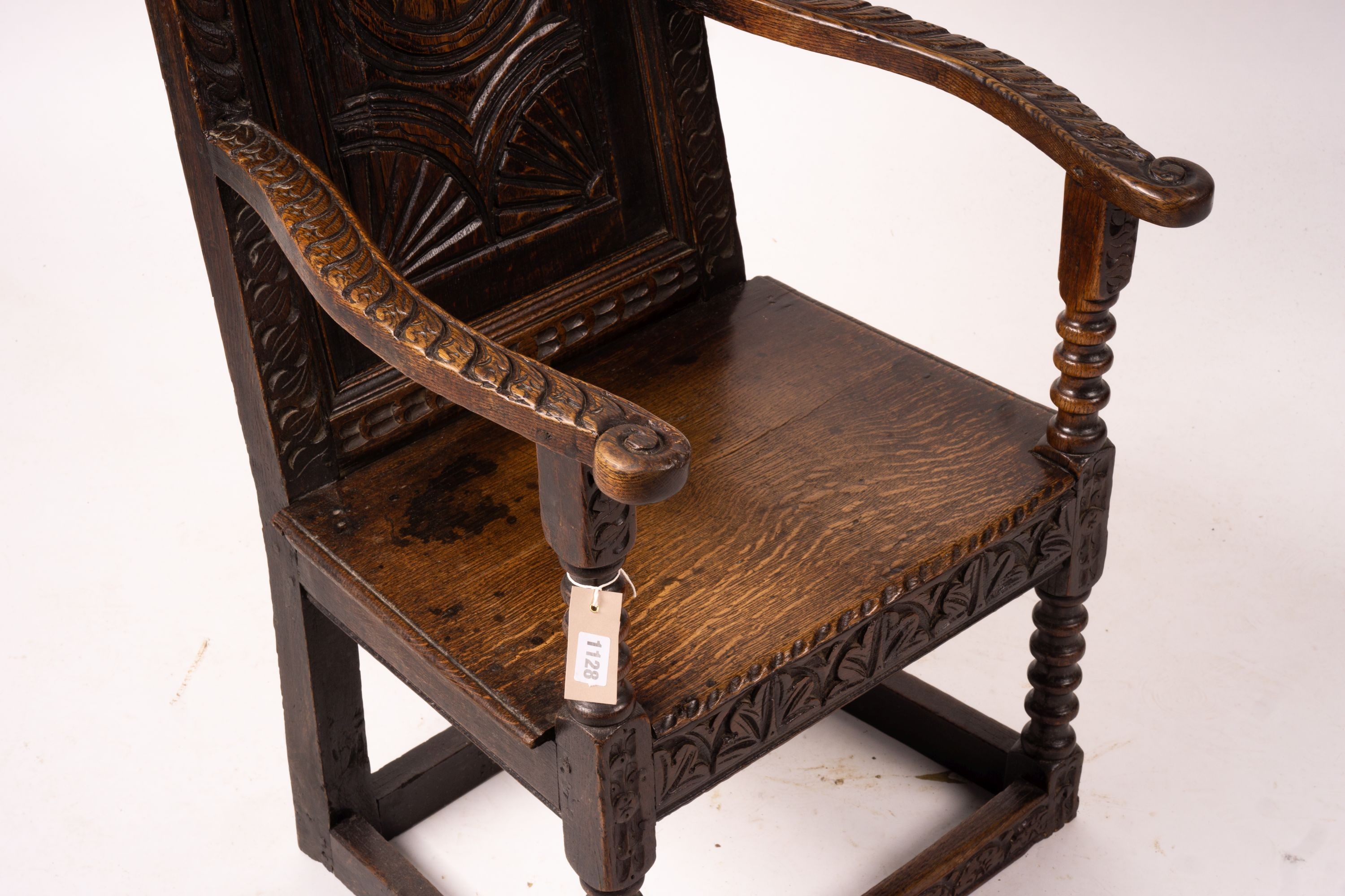 An 18th century style carved oak wainscot chair, width 56cm, depth 60cm, height 101cm